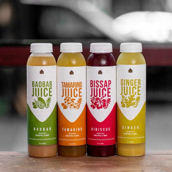 Four bottles of Azara Kitchen's African juices: Baobab, Tamarind, Bissap, and Ginger.